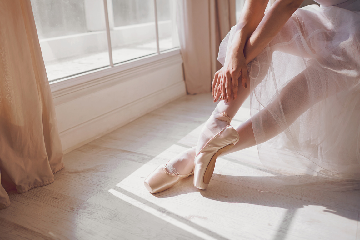 Pointe Shoes on the Feet of a Ballerina.